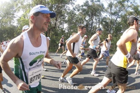 Tony Banfield comepting recently in the Mt Coottha MousDash sporting an impressive Mo!